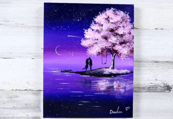 couple in love under blossom cherry tree