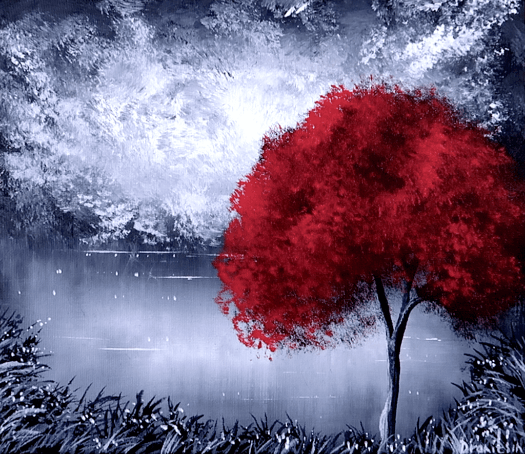 Captivating Contrast: The Vibrancy of a Red Tree in a Black and White Landscape